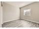 Bedroom with wood floors, neutral walls, and a window with blinds for natural light at 1050 E Cactus Ave # 1049, Las Vegas, NV 89183