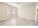 Bedroom featuring neutral walls, ample natural light, and wood-style flooring at 1050 E Cactus Ave # 1049, Las Vegas, NV 89183