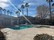 Community pool with ample space for swimming and relaxing, complete with palm trees and beautiful architecture at 1050 E Cactus Ave # 1049, Las Vegas, NV 89183