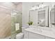 Bright bathroom featuring a glass shower, neutral walls, and a white single sink vanity with a large mirror at 10644 San Vercelli Ct, Las Vegas, NV 89141