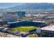 Aerial view of a baseball stadium with commercial buildings and mountains in the background at 12279 Lost Treasure Ave, Las Vegas, NV 89138