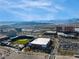 Panoramic aerial view of a baseball stadium, nearby buildings, and parking lots with mountains in the distance at 12279 Lost Treasure Ave, Las Vegas, NV 89138