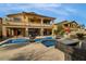 Inviting backyard featuring a pool, outdoor seating, a BBQ and lush landscaping at 12279 Lost Treasure Ave, Las Vegas, NV 89138