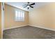 Neutral bedroom with carpet, ceiling fan, and white shutters on the window at 12279 Lost Treasure Ave, Las Vegas, NV 89138