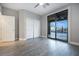 Serene bedroom with neutral tones, closet, and a large sliding glass door overlooking the pool area at 12279 Lost Treasure Ave, Las Vegas, NV 89138