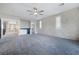 Large bedroom boasting an accent wall, ceiling fan, and a convenient mini-bar area at 12279 Lost Treasure Ave, Las Vegas, NV 89138