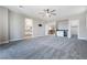 Expansive bedroom with grey walls, ceiling fan, built-in bar, and ensuite bathroom access at 12279 Lost Treasure Ave, Las Vegas, NV 89138