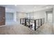 Upstairs game room with carpeted floors, exposed brick accent wall, and modern lighting at 12279 Lost Treasure Ave, Las Vegas, NV 89138