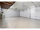 Spacious three car garage featuring a clean epoxy floor and ample storage space at 12279 Lost Treasure Ave, Las Vegas, NV 89138