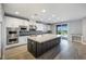 Spacious kitchen with a large island, modern appliances, and natural lighting at 12279 Lost Treasure Ave, Las Vegas, NV 89138