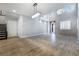 Bright living room and dining area with high ceilings and wood-style flooring at 12279 Lost Treasure Ave, Las Vegas, NV 89138