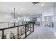 Open loft area with a pool table, modern lighting, and views of the home's architecture at 12279 Lost Treasure Ave, Las Vegas, NV 89138