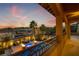 Stunning backyard pool and lounge area with fire pits and tropical landscaping at dusk at 12279 Lost Treasure Ave, Las Vegas, NV 89138