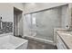 Bathroom featuring a glass shower, marble surround and modern countertops at 12374 Skyracer Dr, Las Vegas, NV 89138