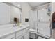 A modern bathroom featuring a glass-enclosed shower and vanity with marble countertop at 12374 Skyracer Dr, Las Vegas, NV 89138