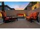 Relaxing outdoor patio area with a modern fire pit and comfortable seating at 12374 Skyracer Dr, Las Vegas, NV 89138