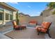 Outdoor seating area with a fire pit and lush landscaping at 12374 Skyracer Dr, Las Vegas, NV 89138