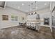 Bright open kitchen featuring an island with stool seating, dining area, and modern appliances at 12374 Skyracer Dr, Las Vegas, NV 89138