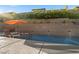 Inviting backyard pool with a tanning ledge, waterfall features, and lush landscaping at 12374 Skyracer Dr, Las Vegas, NV 89138