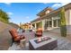 Backyard with pool, outdoor seating, and a modern fire pit at 12374 Skyracer Dr, Las Vegas, NV 89138