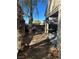 Backyard with mature trees and covered patio area at 1395 Kapelle St, Henderson, NV 89052