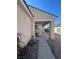 Inviting covered front entrance with desert landscaping and secure ADT home security system at 1395 Kapelle St, Henderson, NV 89052