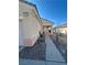 Charming home exterior featuring a covered entrance, desert landscaping and a walkway at 1395 Kapelle St, Henderson, NV 89052