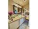 Bathroom featuring granite counters, vessel sink, and large vanity mirror at 1908 Tierra Vista Dr # 206, Las Vegas, NV 89128