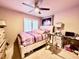 Comfortable bedroom with a ceiling fan, neutral walls, and a queen bed at 1908 Tierra Vista Dr # 206, Las Vegas, NV 89128