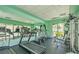 Well-equipped gym room with modern machines, large mirror, and natural light at 1908 Tierra Vista Dr # 206, Las Vegas, NV 89128