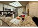 Well-lit kitchen featuring granite countertops and a functional layout for easy cooking at 1908 Tierra Vista Dr # 206, Las Vegas, NV 89128