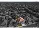 Dramatic aerial view with a home highlighted in color amid a monochrome neighborhood at 2008 Arbor Forest St, Las Vegas, NV 89134