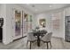 Bright dining area features a round table, gray chairs, and sliding glass doors to the outdoor area at 2008 Arbor Forest St, Las Vegas, NV 89134