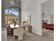 Bright dining room features a chandelier, large windows, and view to the living room with luxury vinyl floors at 2008 Arbor Forest St, Las Vegas, NV 89134