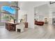 Sophisticated dining room with high ceilings, modern chandelier and seamless flow to living area at 2008 Arbor Forest St, Las Vegas, NV 89134