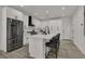 Bright kitchen features stainless steel appliances, white cabinetry, and a center island with seating at 2008 Arbor Forest St, Las Vegas, NV 89134