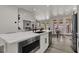 Well-lit kitchen with stainless steel appliances, quartz countertops, a center island, and an open layout at 2008 Arbor Forest St, Las Vegas, NV 89134