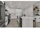 Bright kitchen features stainless steel appliances, white cabinetry, and a center island with seating at 2008 Arbor Forest St, Las Vegas, NV 89134