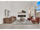 Bright and airy living room showcases a modern fireplace and plenty of natural light at 2008 Arbor Forest St, Las Vegas, NV 89134