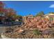 Landscaped entrance to the Canyon Oaks neighborhood featuring stone signage and a decorative rock waterfall at 2008 Arbor Forest St, Las Vegas, NV 89134