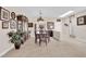 Spacious dining room with ample natural light, neutral color palette and tile flooring at 2244 Garden City Ave, Henderson, NV 89052