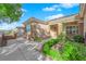 Exterior side view showcasing the lush landscaping, and architecture of the home's entrance at 2244 Garden City Ave, Henderson, NV 89052