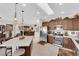 Kitchen with island seating, stainless appliances, and a seamless flow into the dining area at 2244 Garden City Ave, Henderson, NV 89052