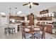 Spacious kitchen and dining area with granite counters, stainless steel appliances, and stylish pendant lighting at 2244 Garden City Ave, Henderson, NV 89052