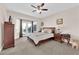 Serene main bedroom with bay windows and access to the backyard, offering a tranquil retreat at 2244 Garden City Ave, Henderson, NV 89052