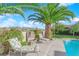 Inviting poolside area with lounge chairs, lush landscaping, and views, ideal for relaxation and enjoying the outdoors at 2244 Garden City Ave, Henderson, NV 89052