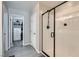 Bathroom features a shower with black hardware, a closet, and gray tile at 225 Sul Ponticello Ave, Las Vegas, NV 89011