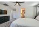 Bright bedroom with neutral walls, a ceiling fan, and plush carpeting at 225 Sul Ponticello Ave, Las Vegas, NV 89011