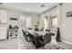 Cozy dining area with stylish furnishings, an adjacent coffee bar, and sliding glass doors at 225 Sul Ponticello Ave, Las Vegas, NV 89011