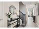 Inviting entryway with tiled floors, a console table, and stairs to the upper level at 225 Sul Ponticello Ave, Las Vegas, NV 89011